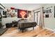 Bright bedroom with wood floors and ample natural light, complemented by stylish decor at 6213 Willow Ln, Boulder, CO 80301