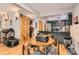 Eat-in kitchen featuring a round table, gray dining chairs, and a convenient sliding barn door at 6213 Willow Ln, Boulder, CO 80301