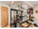 This updated kitchen features stainless steel appliances, granite countertops, and pendant lighting at 6213 Willow Ln, Boulder, CO 80301