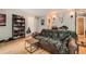 Comfortable living room offers a cozy seating area, shelving, and bright natural light at 6213 Willow Ln, Boulder, CO 80301