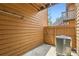A compact, fenced patio area with concrete pad and AC unit at 6213 Willow Ln, Boulder, CO 80301