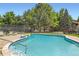 Community pool with lounge chairs and a secure fence at 6213 Willow Ln, Boulder, CO 80301