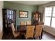 Formal dining room with rich wood floors and cabinet at 10636 Racine Cir, Commerce City, CO 80022