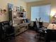 Office with a desk and dual rolling office chairs at 10636 Racine Cir, Commerce City, CO 80022