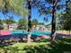 Two community tennis courts surrounded by trees at 12593 E Pacific Cir # E, Aurora, CO 80014