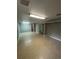 Spacious basement featuring an open layout and neutral color palette at 7020 W Portland Ave, Littleton, CO 80128