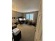 Bright bedroom with plush carpet and a large window providing plenty of natural light at 7020 W Portland Ave, Littleton, CO 80128