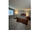 Cozy bedroom featuring a comfortable bed, window, and bedside table, perfect for relaxation at 7020 W Portland Ave, Littleton, CO 80128