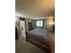 Cozy bedroom featuring a comfortable bed, window, and bedside table, perfect for relaxation at 7020 W Portland Ave, Littleton, CO 80128