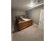 Cozy bedroom with natural wood bedframe and neutral decor at 7020 W Portland Ave, Littleton, CO 80128