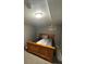 Cozy bedroom with natural wood bedframe and neutral decor at 7020 W Portland Ave, Littleton, CO 80128