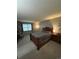 Cozy bedroom featuring a comfortable bed, window, and bedside table, perfect for relaxation at 7020 W Portland Ave, Littleton, CO 80128