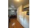 Kitchen view showing access to the dining room at 7020 W Portland Ave, Littleton, CO 80128
