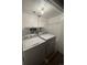 Bright laundry room with a modern white washer and dryer at 7020 W Portland Ave, Littleton, CO 80128