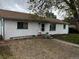 Attractive house with white walls, a brown roof, and blue trim, offering a cozy, updated curb appeal at 5515 Zuni St, Denver, CO 80221
