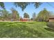 Large backyard featuring a barn and maintained lawn at 14505 W 52Nd Ave, Arvada, CO 80002