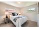 Neutral bedroom with carpet, two windows, and side tables at 14505 W 52Nd Ave, Arvada, CO 80002
