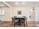 Cozy dining area featuring a round table, four chairs, and modern decor at 14505 W 52Nd Ave, Arvada, CO 80002