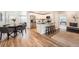 Open concept kitchen with stainless steel appliances, modern lighting, and a breakfast bar at 14505 W 52Nd Ave, Arvada, CO 80002