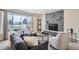 Inviting living room with stone fireplace, sofa, chairs and large picture window at 14505 W 52Nd Ave, Arvada, CO 80002