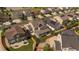 An aerial view of a property shows the yard, porch, and adjacent neighborhood at 15201 Yellowthroat St, Parker, CO 80134