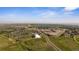 An aerial view highlights the neighborhood, baseball field, football field, and dome at 15201 Yellowthroat St, Parker, CO 80134