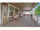 Relaxing back porch with comfortable egg chairs, a heater, and a view of the backyard at 15201 Yellowthroat St, Parker, CO 80134