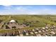 This aerial view features a nearby baseball field with green grass and a dome at 15201 Yellowthroat St, Parker, CO 80134