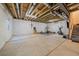 Unfinished basement with exposed ceiling, concrete floor, and potential for customization at 15201 Yellowthroat St, Parker, CO 80134