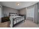Comfortable bedroom with neutral walls, carpet, and ample natural light from the window at 15201 Yellowthroat St, Parker, CO 80134