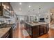 Spacious open concept kitchen with granite countertops, stainless steel appliances, and an eat-in dining area at 15201 Yellowthroat St, Parker, CO 80134