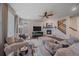 Spacious living room with hardwood floors, fireplace, and open to the staircase at 15201 Yellowthroat St, Parker, CO 80134