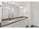 Double vanity bathroom with granite countertop and shower at 3037 Lake Helen Blvd, Mead, CO 80542