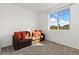 Cozy bedroom with a sofa bed, large window, and carpet flooring at 3037 Lake Helen Blvd, Mead, CO 80542