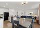 Open concept dining area with view into kitchen and living room at 3037 Lake Helen Blvd, Mead, CO 80542