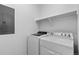 Laundry room with washer and dryer, and overhead shelving at 3037 Lake Helen Blvd, Mead, CO 80542