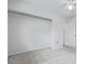 White bedroom features carpet, built-in closet, and an entrance doorway at 5542 Sable St, Denver, CO 80239