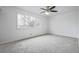 Bright bedroom featuring a ceiling fan and a large window at 5542 Sable St, Denver, CO 80239