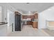 Spacious kitchen featuring stainless steel appliances, granite countertops, and wood cabinets at 5542 Sable St, Denver, CO 80239