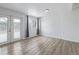 Well-lit living room features wood floors, a large window, and neutral decor at 5542 Sable St, Denver, CO 80239