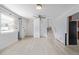 Bright living room featuring updated flooring, staircase, and fresh white paint for a modern and airy feel at 5542 Sable St, Denver, CO 80239