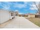 Concrete patio area offers outdoor enjoyment and relaxation space with easy access to sheds and the house at 5542 Sable St, Denver, CO 80239