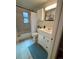 Bathroom featuring a shower-tub combo, vanity, updated lighting, and neutral colors, clean and functional at 3690 N Hudson St, Denver, CO 80207