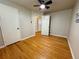 Bedroom featuring hardwood floors, ceiling fan, and closet space, offering a comfortable and functional layout at 3690 N Hudson St, Denver, CO 80207