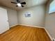 Simple bedroom featuring hardwood floors, ceiling fan, and a blank canvas ready for personalization at 3690 N Hudson St, Denver, CO 80207