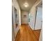 Well-lit hallway featuring hardwood floors and neutral walls, creating a clean and inviting space at 3690 N Hudson St, Denver, CO 80207