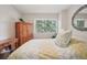 Charming bedroom featuring a window with outdoor views and a decorative bedspread at 7995 E Mississippi Ave # F23, Denver, CO 80247