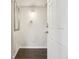Inviting entryway with tile floors, a modern mirror, and a secure digital lock system on the front door at 7995 E Mississippi Ave # F23, Denver, CO 80247