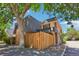Charming home featuring a lovely mix of stone, brick, and wood with a wooden privacy fence at 7995 E Mississippi Ave # F23, Denver, CO 80247