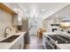 Eat-in kitchen with updated stainless appliances and sight lines to the living room at 7995 E Mississippi Ave # F23, Denver, CO 80247